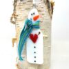 snowman in teal scarf
